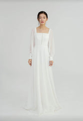Elegant long-sleeve A-line maxi dress crafted from airy organza fabric